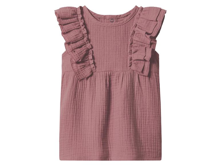 Robe bébé rose avec manches à volants et tissu texturé