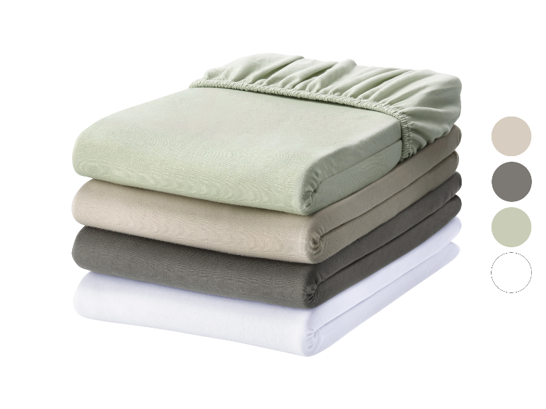 Ensemble de draps en coton de différentes couleurs.