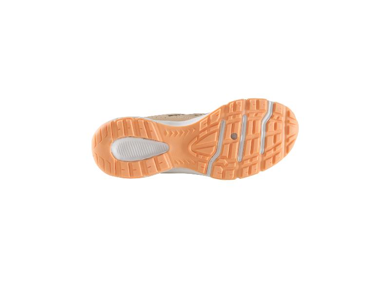 Semelle de baskets beige avec détails orange.