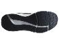 Semelle de chaussure de sport noire et blanche avec motif d'adhérence.