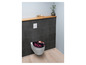 Abattant de toilette à imprimé floral dans une salle de bain.