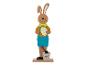 Un lapin de Pâques en bois avec un œuf, une pelle et un seau.