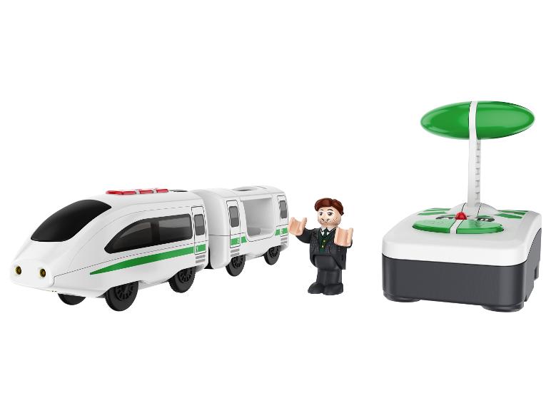 Un train jouet avec télécommande, une figurine et une manette.