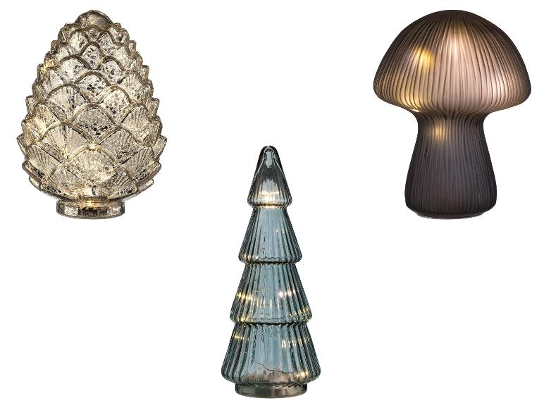 Trois lampes décoratives en verre : une pomme de pin, un sapin de Noël et un champignon.