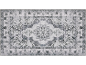 Tapis gris avec un motif classique, délavé et un médaillon central.