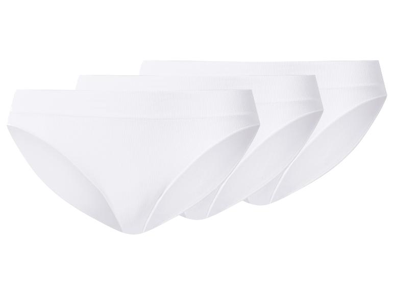 Lot de trois culottes côtelées blanches.