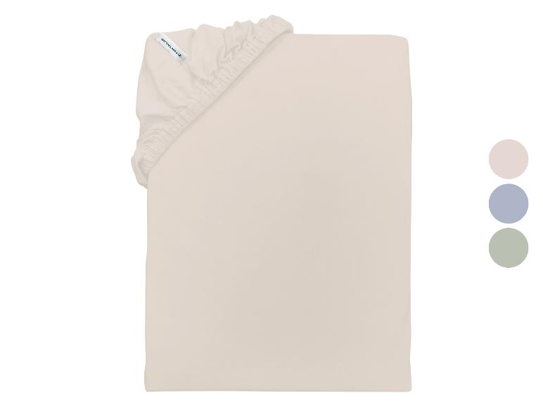 Drap-housse beige avec élastique, avec étiquette visible et trois échantillons de couleur.