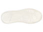 Semelle de baskets blanche avec un motif grossier.