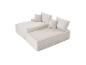 Canapé modulaire beige deux pièces avec coussins, texture velours côtelé.