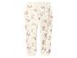 Pantalon de survêtement enfant couleur crème avec motifs arcs-en-ciel et cœurs roses.