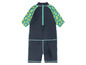 Un maillot de bain bleu foncé à manches courtes avec un motif citron.