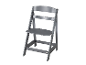 Une chaise haute Tripp Trapp grise.