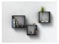 Trois étagères murales noires avec des livres, des plantes, des objets décoratifs et un cloche en verre.