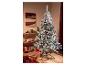 Un sapin de Noël floqué avec des ornements colorés dans un salon festif.