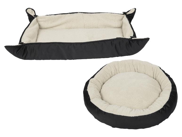 Deux lits pour animaux de compagnie, un rectangulaire et un rond, tous deux noirs avec un intérieur crème moelleux.