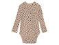 Un body bébé beige à pois bleus