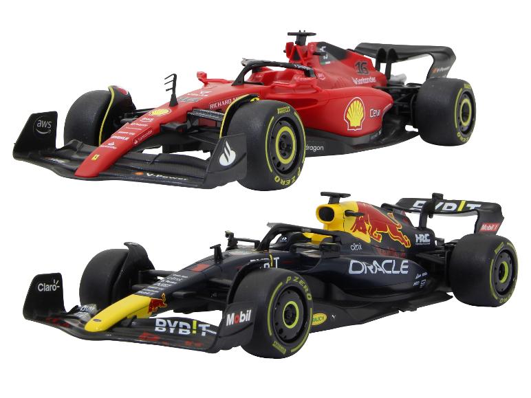 Deux modèles de voitures de course de Formule 1, une Ferrari rouge et une Red Bull noire.