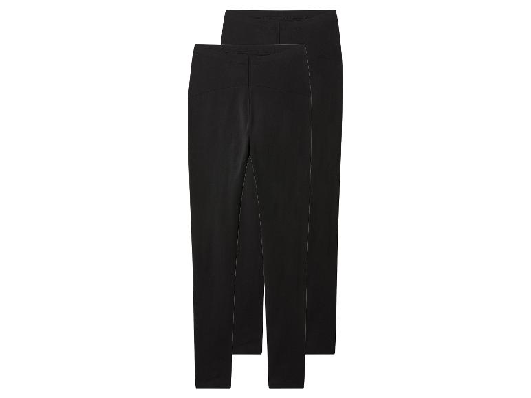 Deux paires de leggings noirs, pliées et empilées.