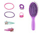 Une brosse à cheveux violette, des pinces à cheveux et des élastiques à cheveux sur le thème de Barbie.