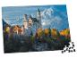 Puzzle du château de Neuschwanstein et des montagnes enneigées, avec des pièces manquantes