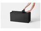 Boîtes de rangement noires avec inserts.
