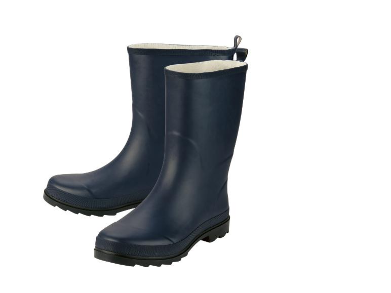 Une paire de bottes de pluie bleu foncé avec doublure blanche.