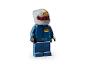 Minifigurine LEGO d'un pilote de course en combinaison bleue Red Bull et casque gris.