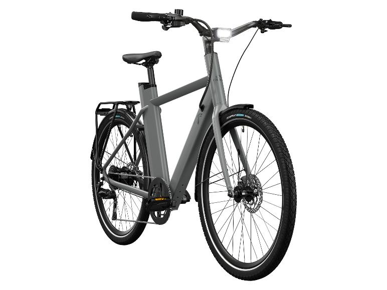 Un vélo électrique gris avec un pneu Schwalbe Big Ben.