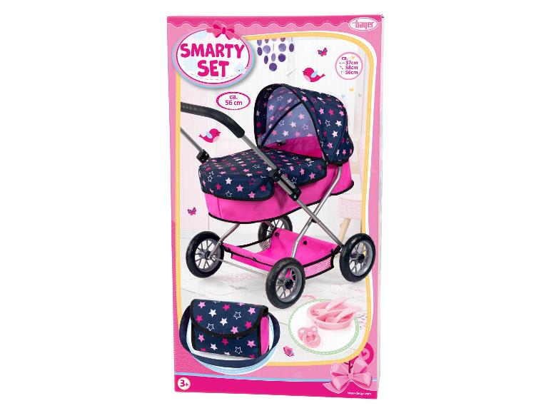 Une poussette de poupée rose avec un motif d'étoiles de Bayer Design.
