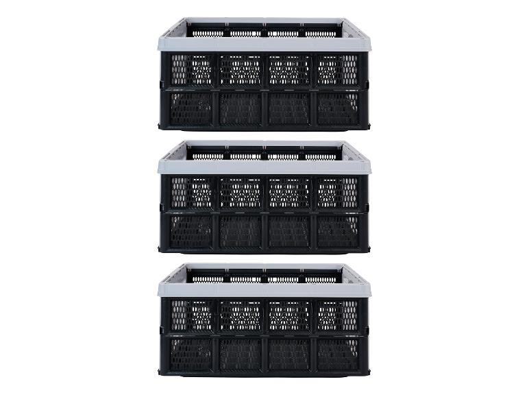 Trois caisses pliables noires avec des bords gris, empilées les unes sur les autres.