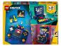 Un ensemble de jouets de construction 3-en-1 comprenant un ordinateur rétro, une console de jeu portable et une borne d'arcade.