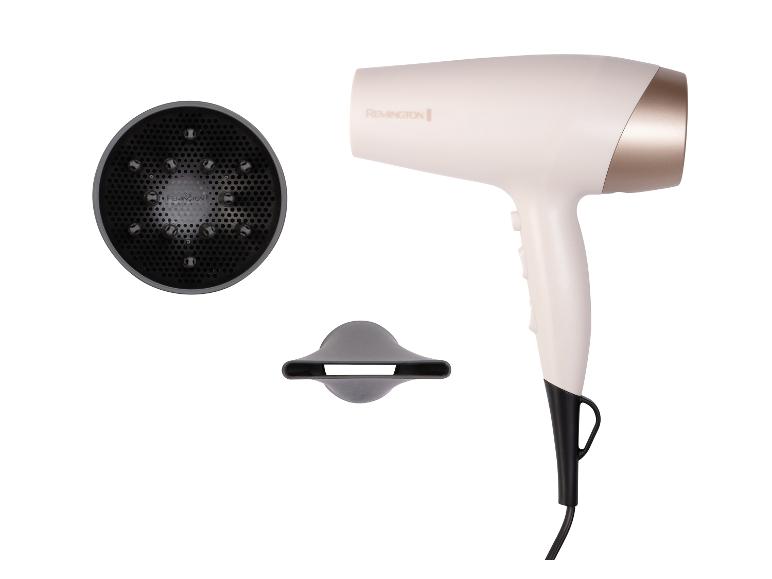Sèche-cheveux blanc et or avec diffuseur et concentrateur sur fond blanc.