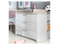 Commode blanche avec trois tiroirs et plan à langer pour bébé.