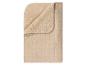 Couverture beige avec doublure en sherpa et motif chevron.