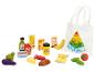 Aliments jouets en bois et sac fourre-tout blanc avec pyramide alimentaire.