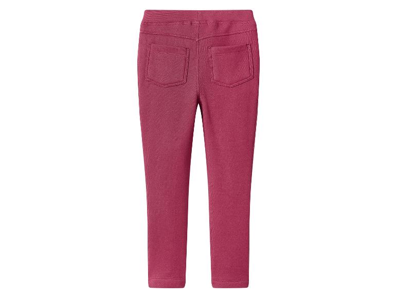 Vue arrière d'un legging uni rose foncé avec deux poches arrière