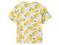 T-shirt blanc avec motif de citrons jaunes et feuilles vertes.