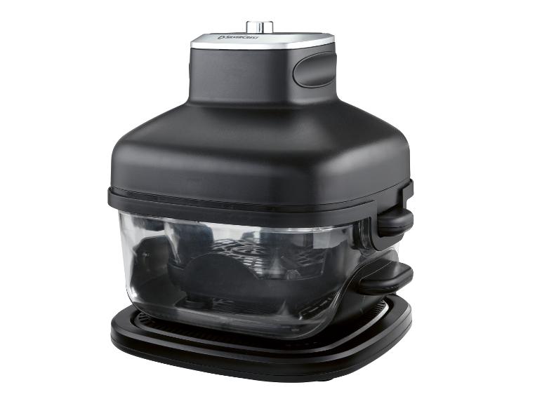 Friteuse à air noire avec un récipient transparent et une base.
