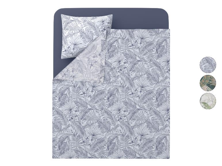 Parure de lit avec imprimé tropical de feuilles et fleurs en gris et blanc.