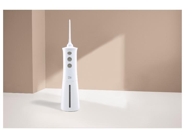 Hydropulseur blanc avec trois boutons et indicateur de niveau d'eau, sur fond blanc.