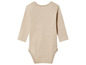 Un body bébé rayé beige à manches longues.