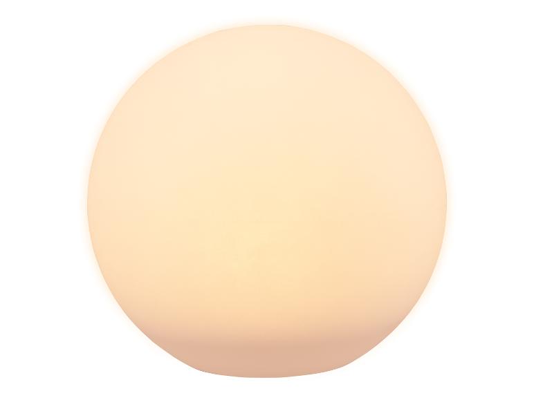 Luminaire ovale à lumière douce et chaude sur fond blanc.
