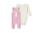 Combinaison velours rose à oreilles de lapin et body blanc pour bébé.