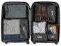 Valise organisée avec des cubes de rangement pour vêtements, chaussures et accessoires.