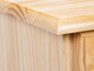 Le dessus d'une armoire en bois avec un tiroir.
