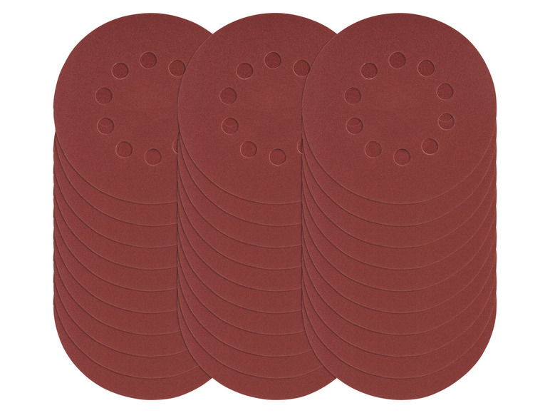Trois piles de papier de verre avec des disques de ponçage ronds.