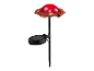 Lampe solaire en forme de champignon rouge à pois blancs.