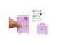 Coffret de jeu Barbie avec valise violette et autocollants.