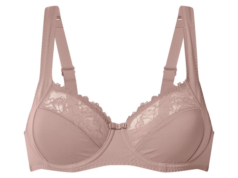 Soutien-gorge rose poudré avec bonnets en dentelle et petit nœud central.
