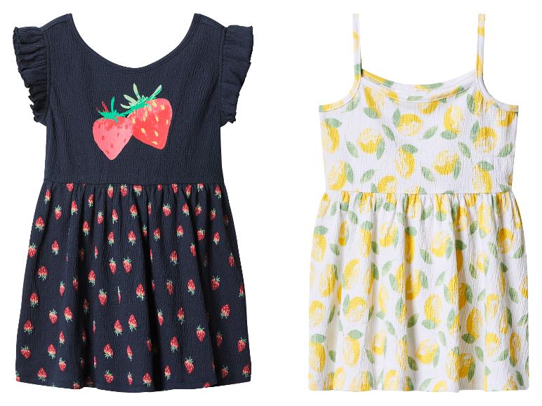 Robes d'été pour filles: une bleue avec des fraises et une blanche avec des citrons.